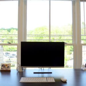 Computer monitor on a coworking office desk